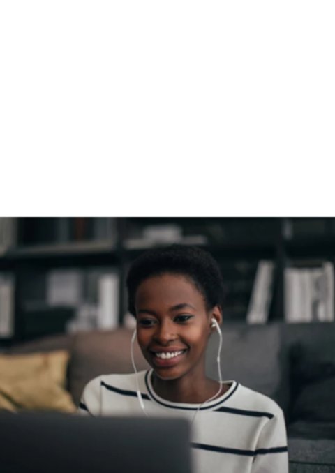 Smiling woman wearing earphones and looking at laptop screen